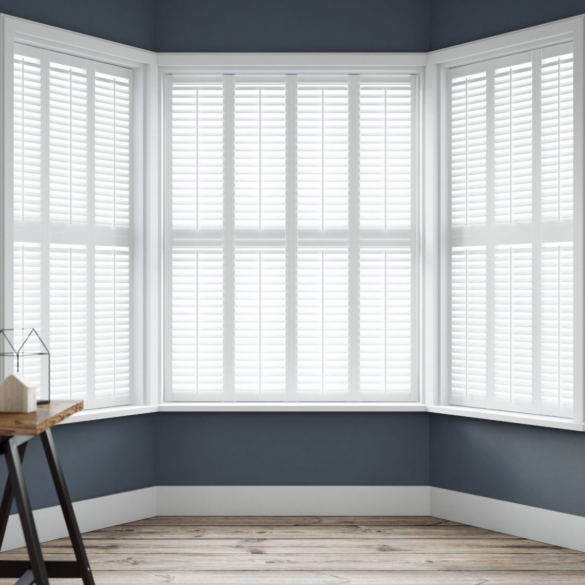 White full height plantation shutters fitted to a bay window in a Chester home